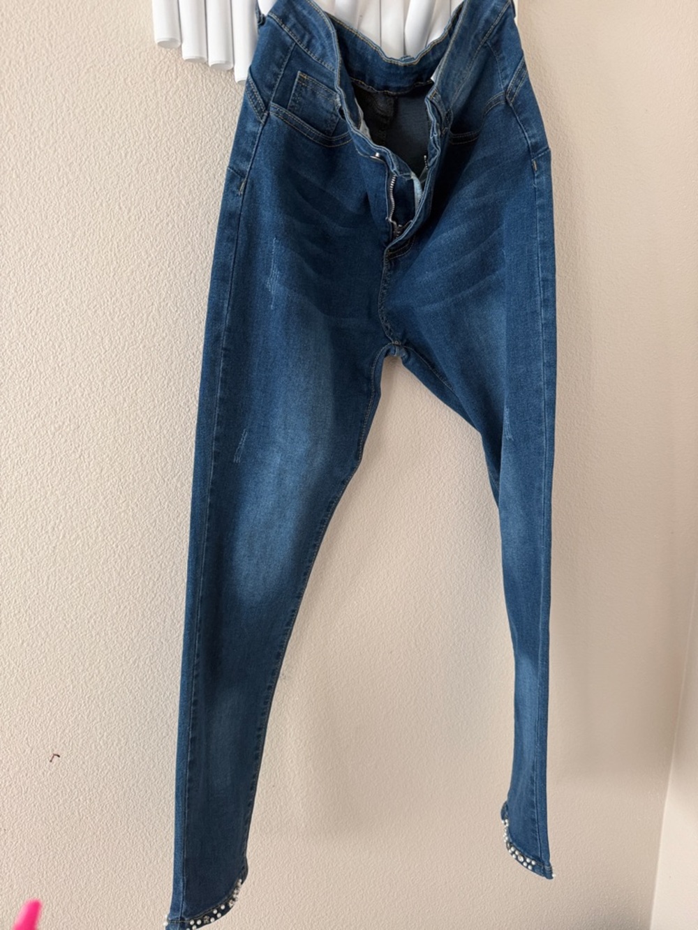 Dark Wash High-Waist Skinny Jeans with Embellished Hem